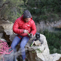 Man cooking on the floor with the Jetboil MicroMo on the mountain