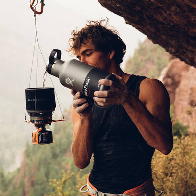 Man pouring water into the Jetboil MiniMo hanging from a string