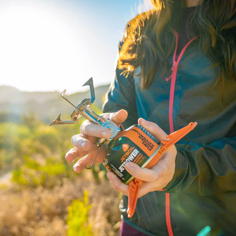 Women attaching the Jetboil MightyMo on the Jetboil JetPower fuel