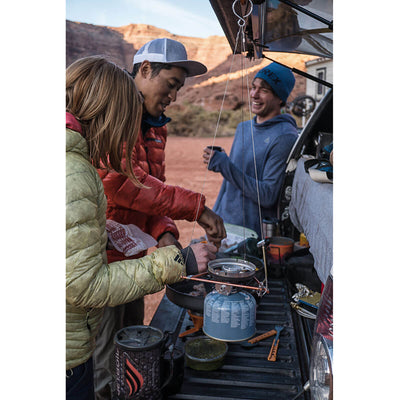 Three people cooking in the trunk of their car using the Jetboil Flash