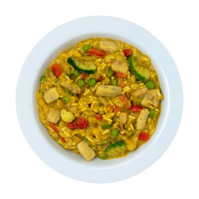 yellow curry with chicken served on white plate