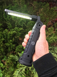 hand holding 72HRS LED Work Light with light on