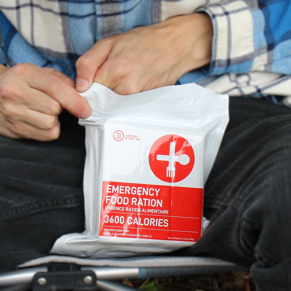 Man closing resealable ziplock of 72 HRS 3600 calorie food rations