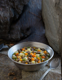 Mountain House Beef Stew served in metal bowl with spork on the side