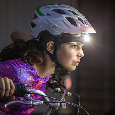 girl using COB LED Headlamp - 200 Lumen while biking