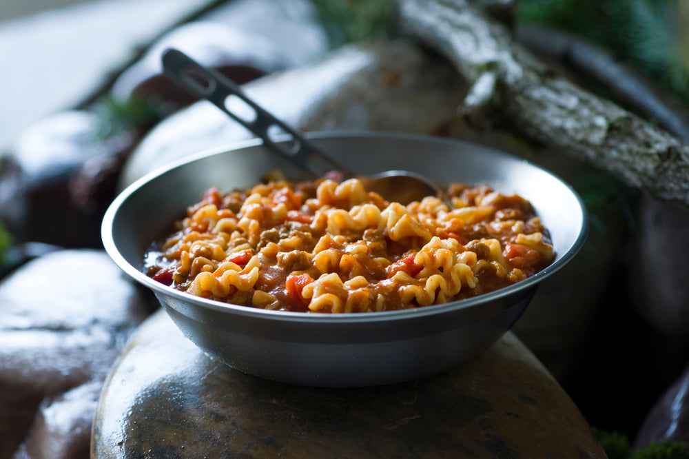 lasagna with meat sauce served in metal bowl