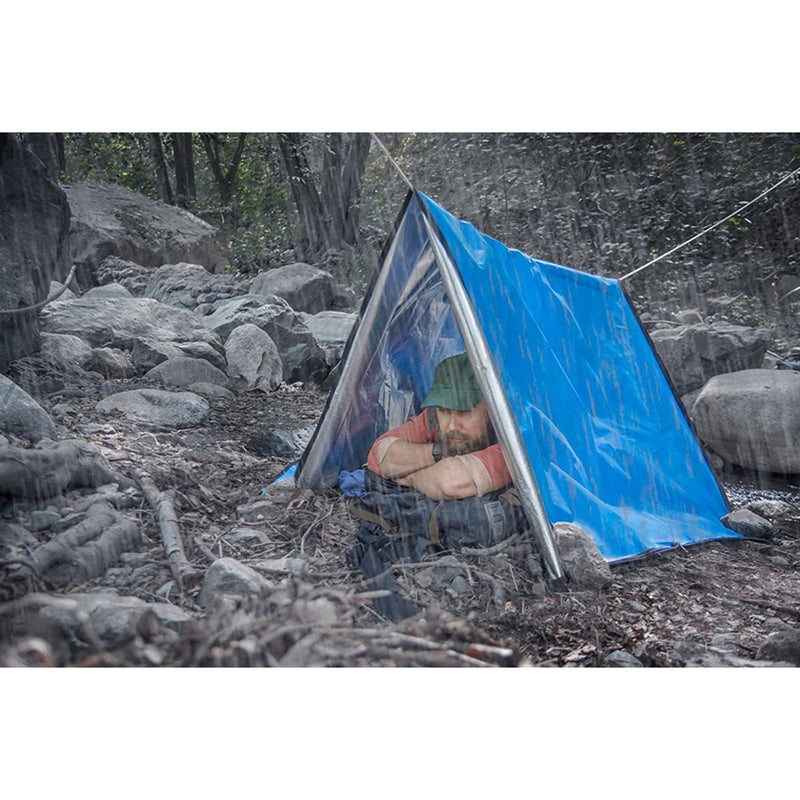 man sleeping in Heavy Duty Emergency Sleeping Bag (Single Person) pitched as tent in the rain