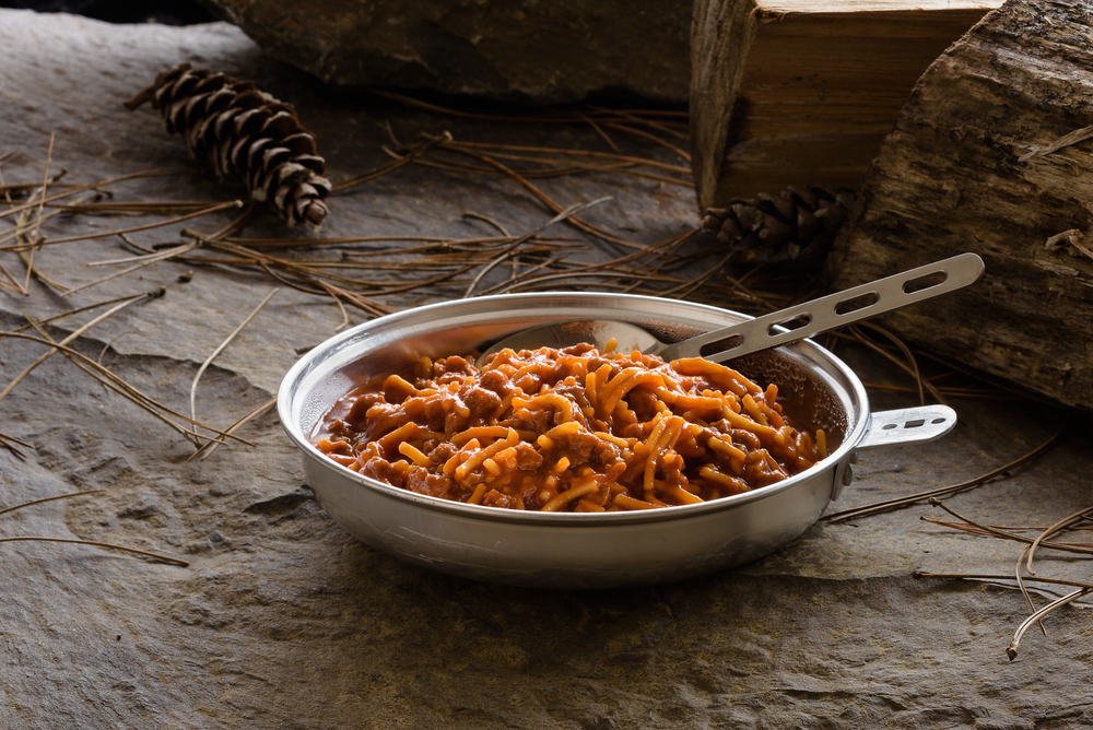 spaghetti with meat sauce served in metal camping plate
