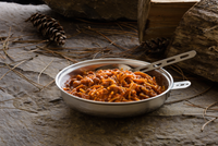 spaghetti with meat sauce served in metal camping plate